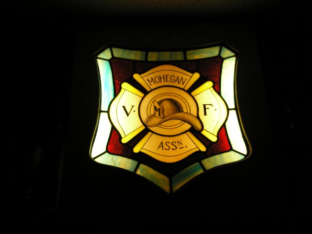 The Refurbished MVFA Lighted Stain Glass Sign Mounted in Meeting Room At Headquarters